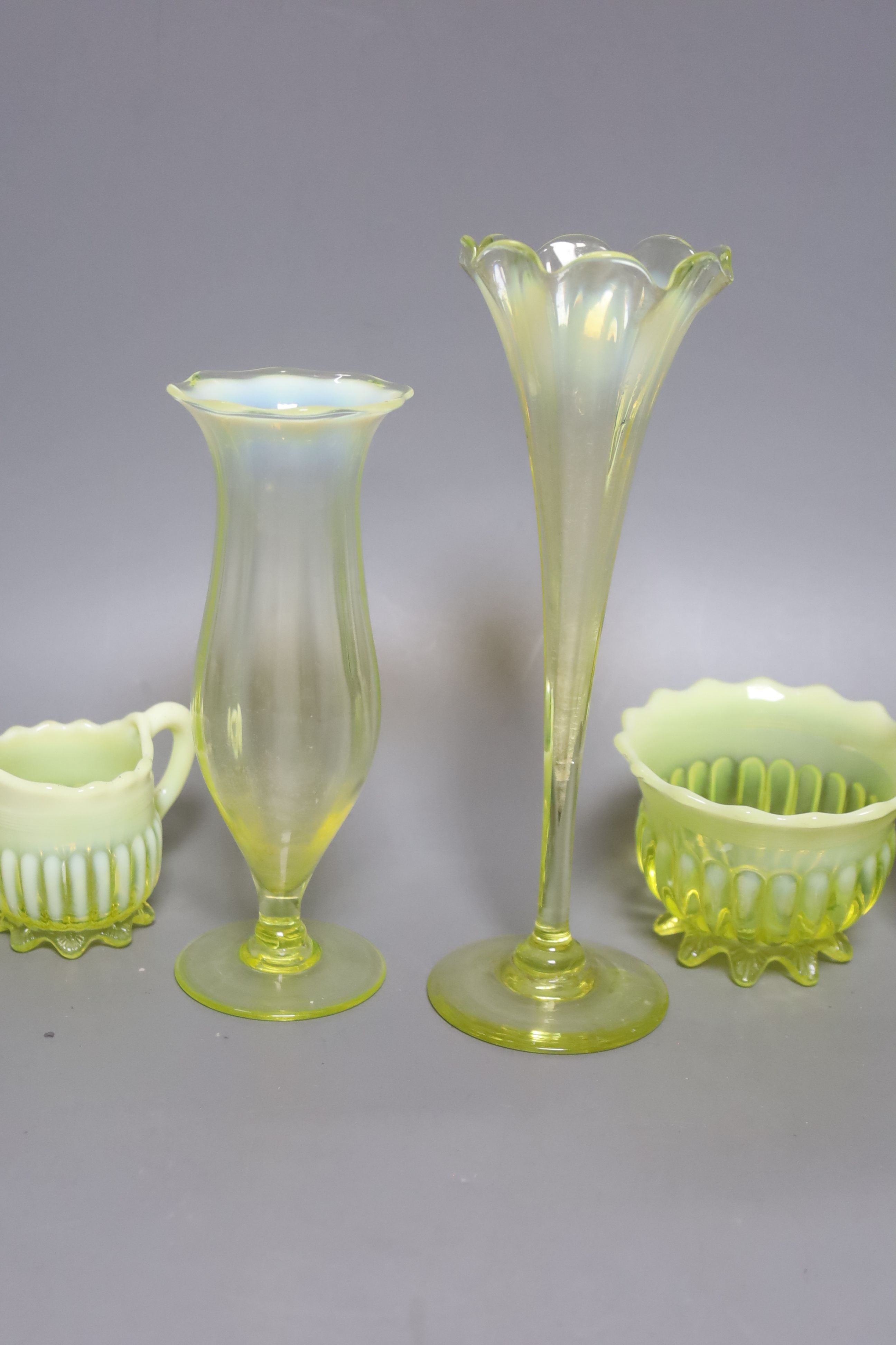 A group of assorted vaseline glass items, tallest 20cm